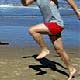 single leg bounding at the beach