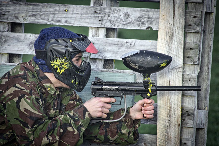 Paintball player in hiding