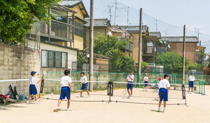Children playing tennis in Japan