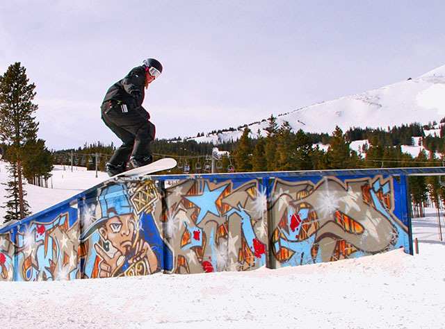 snowboarder on a slopestyle course