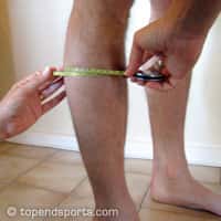calf girth measurement technique showing tape measure placement