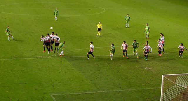a football players attempt at goal