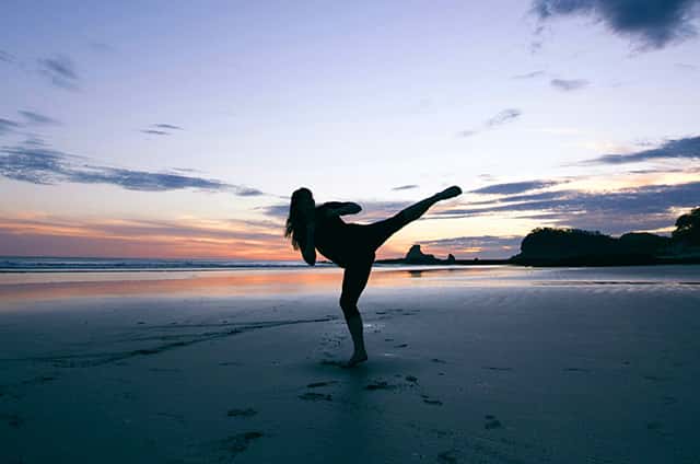 high kick at sunset