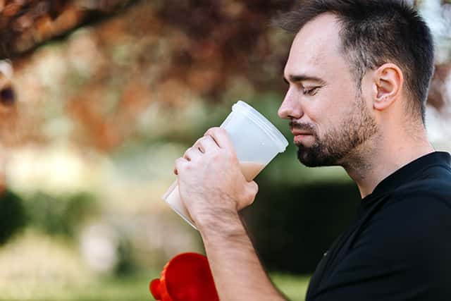drinking a protein shake