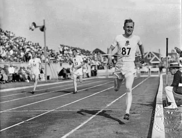 English runner Lord Burghley crosses the finish line at the 1930 Games