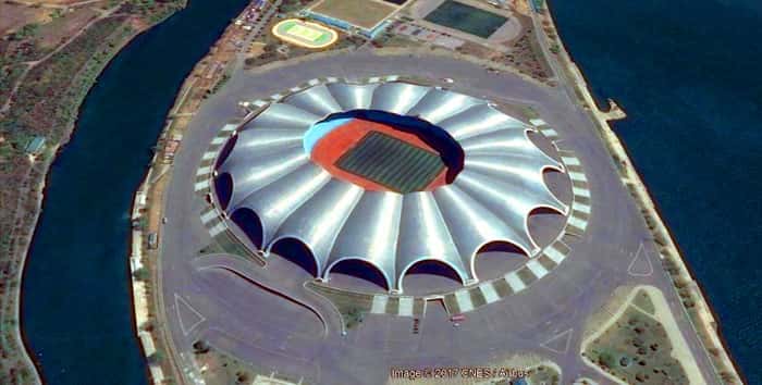 Rungrado 1st of May Stadium aerial view showing distinctive petal-shaped roof design in Pyongyang, North Korea