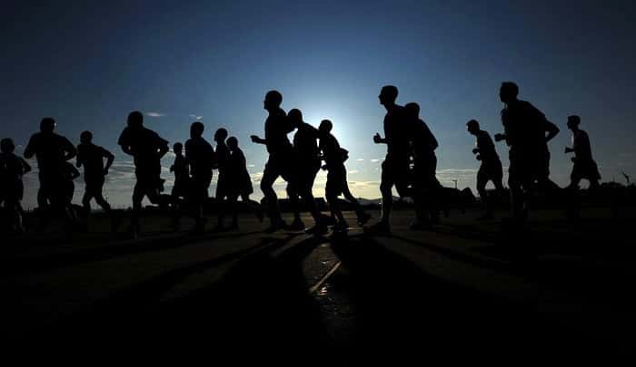 Athletes performing the Cooper 12-minute run test on a track