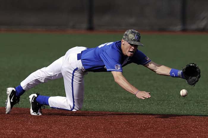 Baseball player stretching demonstrating the physical demands of professional baseball