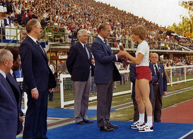The Duke of Edinburgh presenting the Queen's Baton to Raelene Boyle at 1982 Commonwealth Games in Brisbane (image: Queensland State Archives)