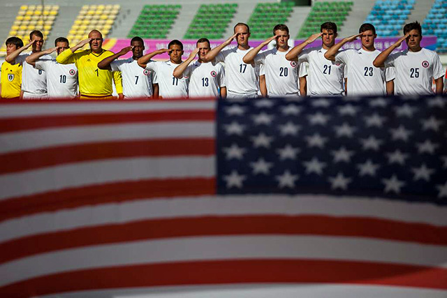USA soccer team saluting their flag before a game