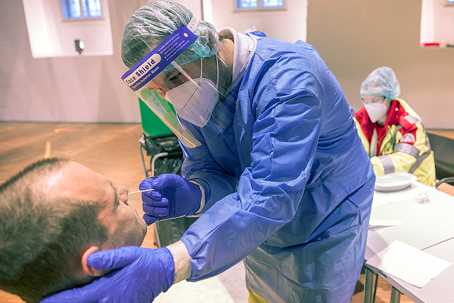 a nasal swab being collected