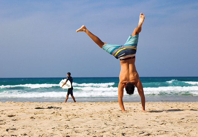handstand at the beach