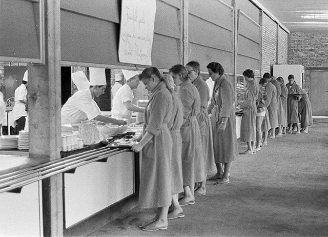 swimmers lining up for a meal at th Rome Olympics
