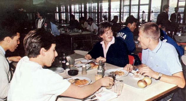 Athletes enjoying a meal at the Olympic Village dining hall
