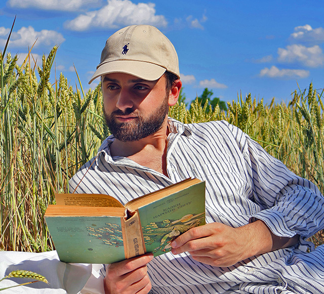 reading a book in the cornfield