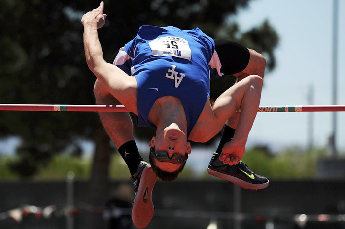 a high jumper clears the bar