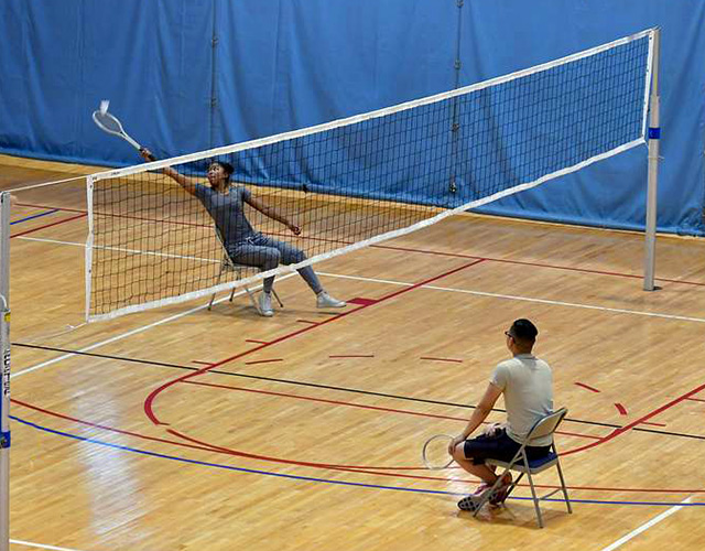 a sitting badminton game 