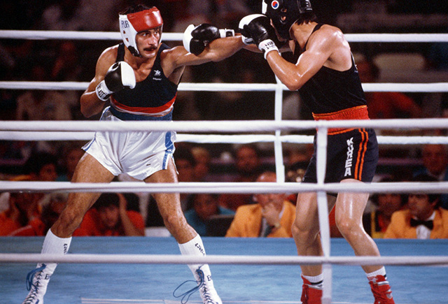Aristedes Gonzales, of Puerto Rico, boxes Joon-Sup Shin of South Korea during the 1984 Summer Olympics