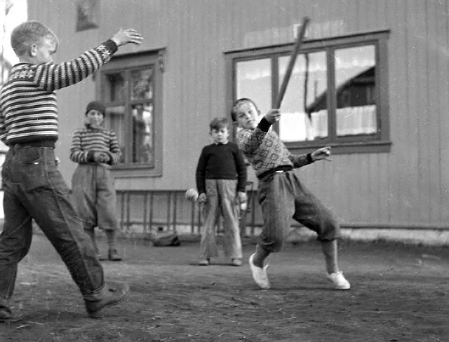 kids playing a bat and ball game in Norway