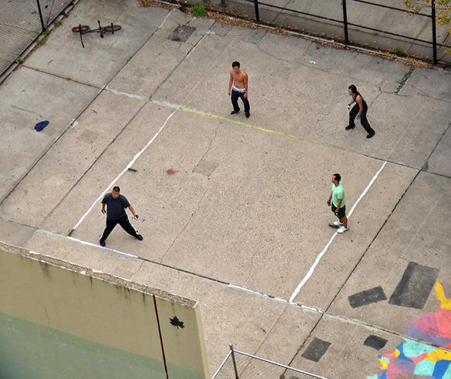 four people playing handball