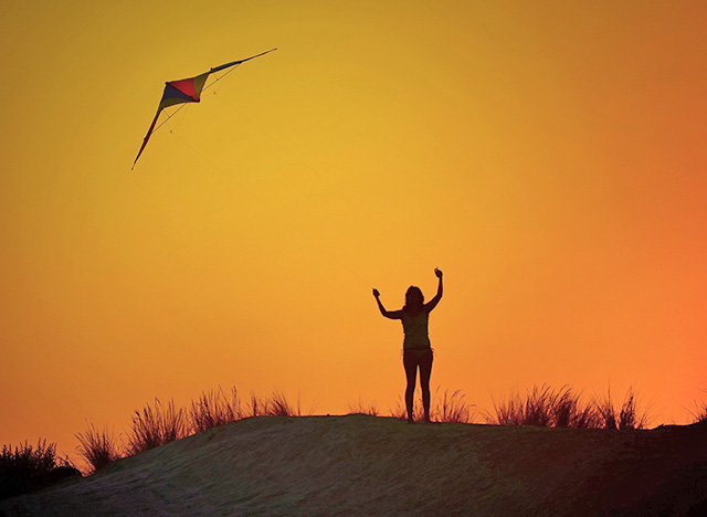 flying a stunt kite 