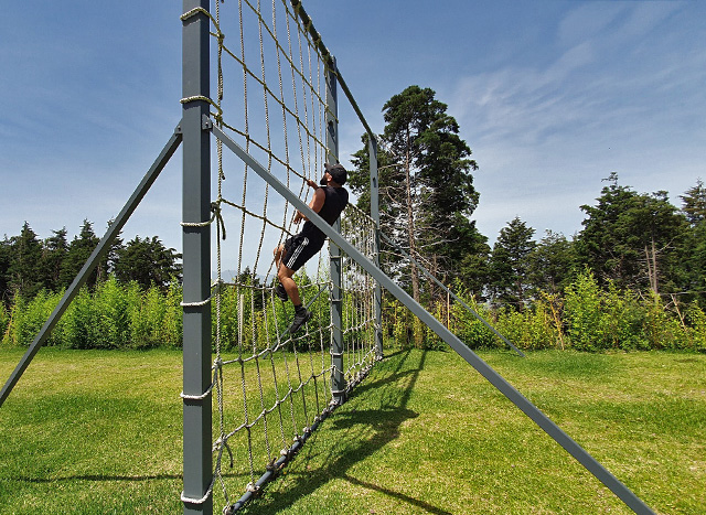 climbing a rope net 