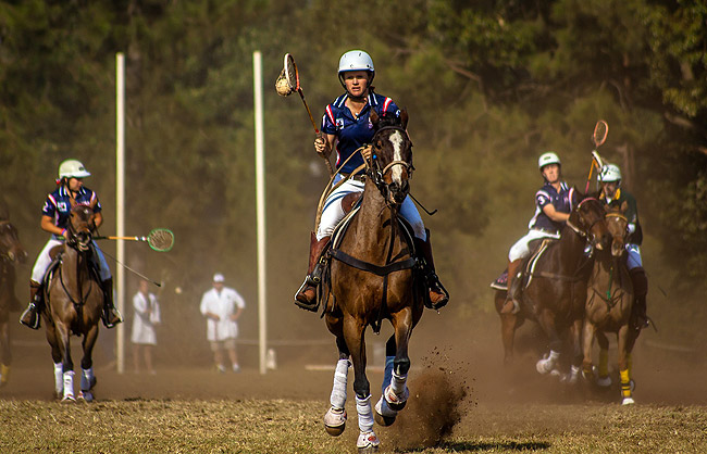 a polocrosse match in action