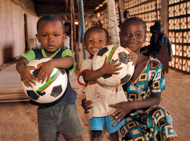 Orphan children in Sierra Leone receiving soccer balls