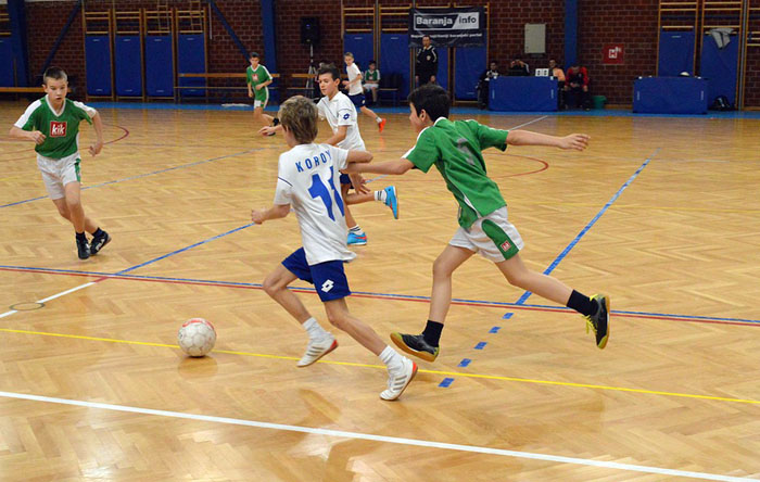 boys playing indoor soccer