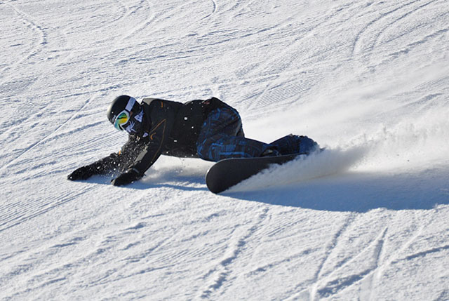 snowboarder taking a tight turn